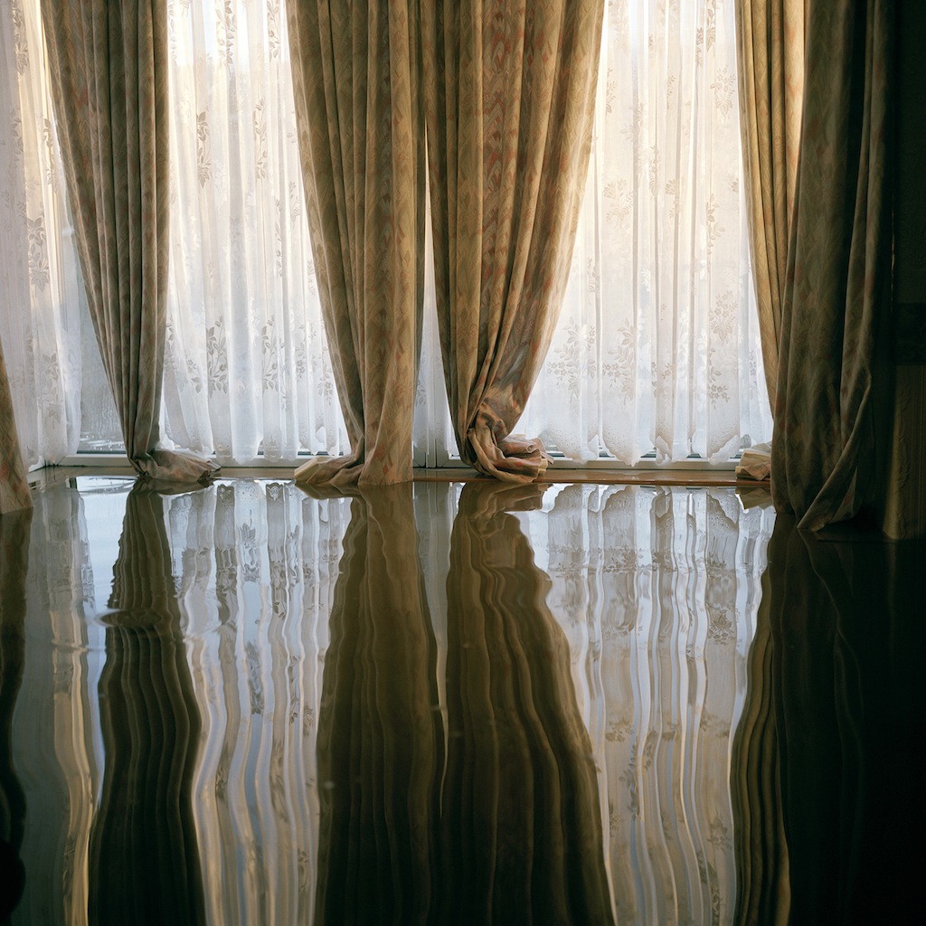 The reflection of some curtains inside a house in Toll Bar village near Doncaster shows how high floodwaters had risen in many houses, as high as the windows. This was one of the communities flooded when a freak storm unleashed a deluge of rain on parts of northern England in which more than four inches of rain fell in 24 hours. The devastation was caused by extreme and unpredictable weather and it is this kind of freak event, which climate scientists have been predicting, will become more frequent as a consequence of global warming.
